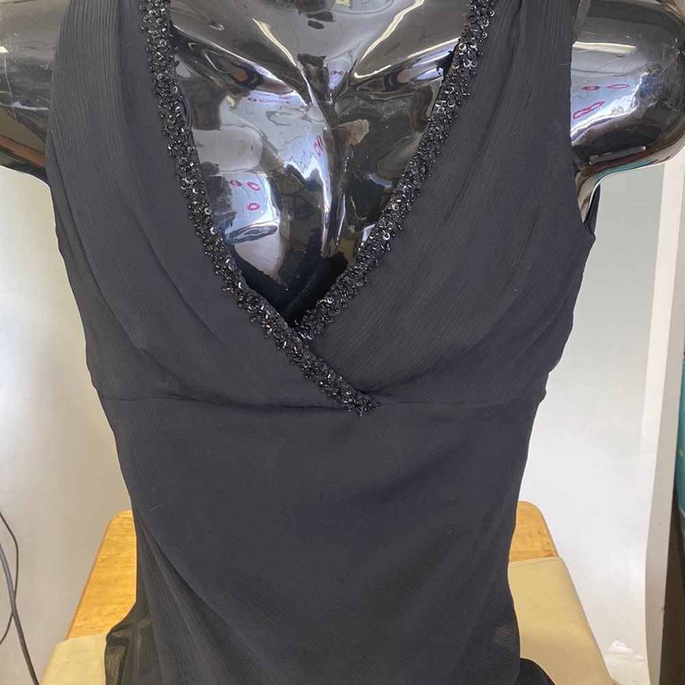Designer mid length dress with v neck beaded detail